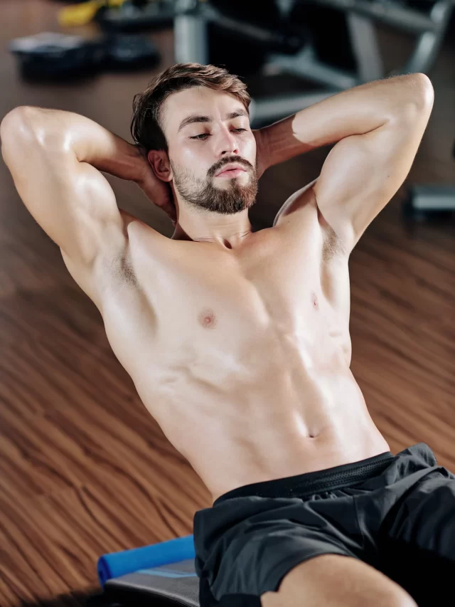 shirtless-handsome-fit-young-man-doing-crunches-bench-gym